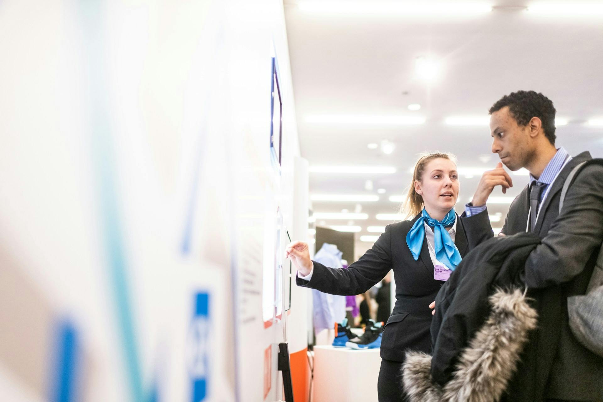 A candidate speaking to a recruiter at a career fair