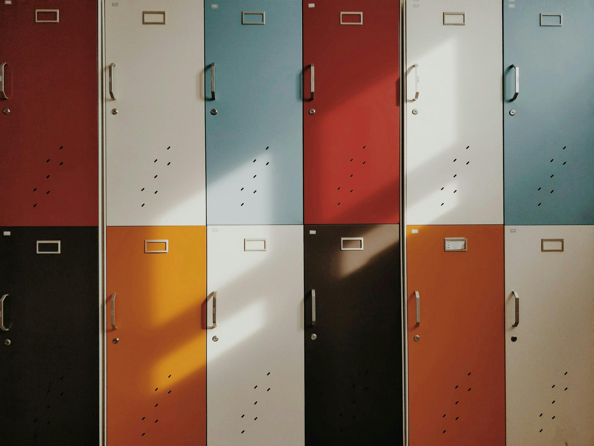 Multi-coloured lockers in a school hallway