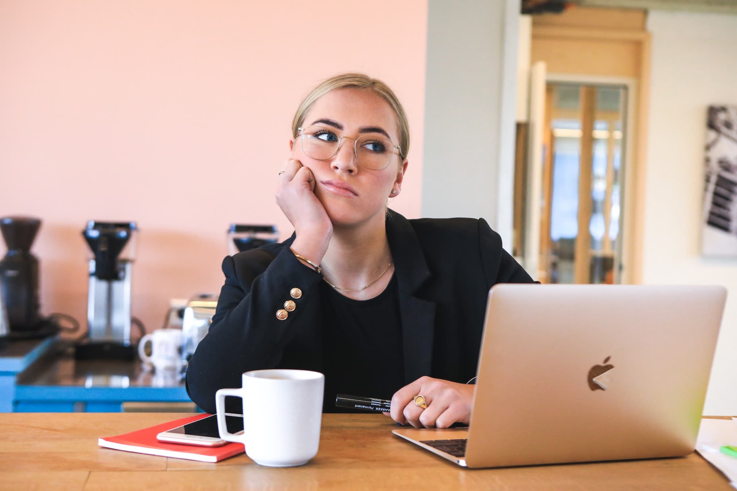 A female recruiter at her desk looking discouraged after an interview no-show